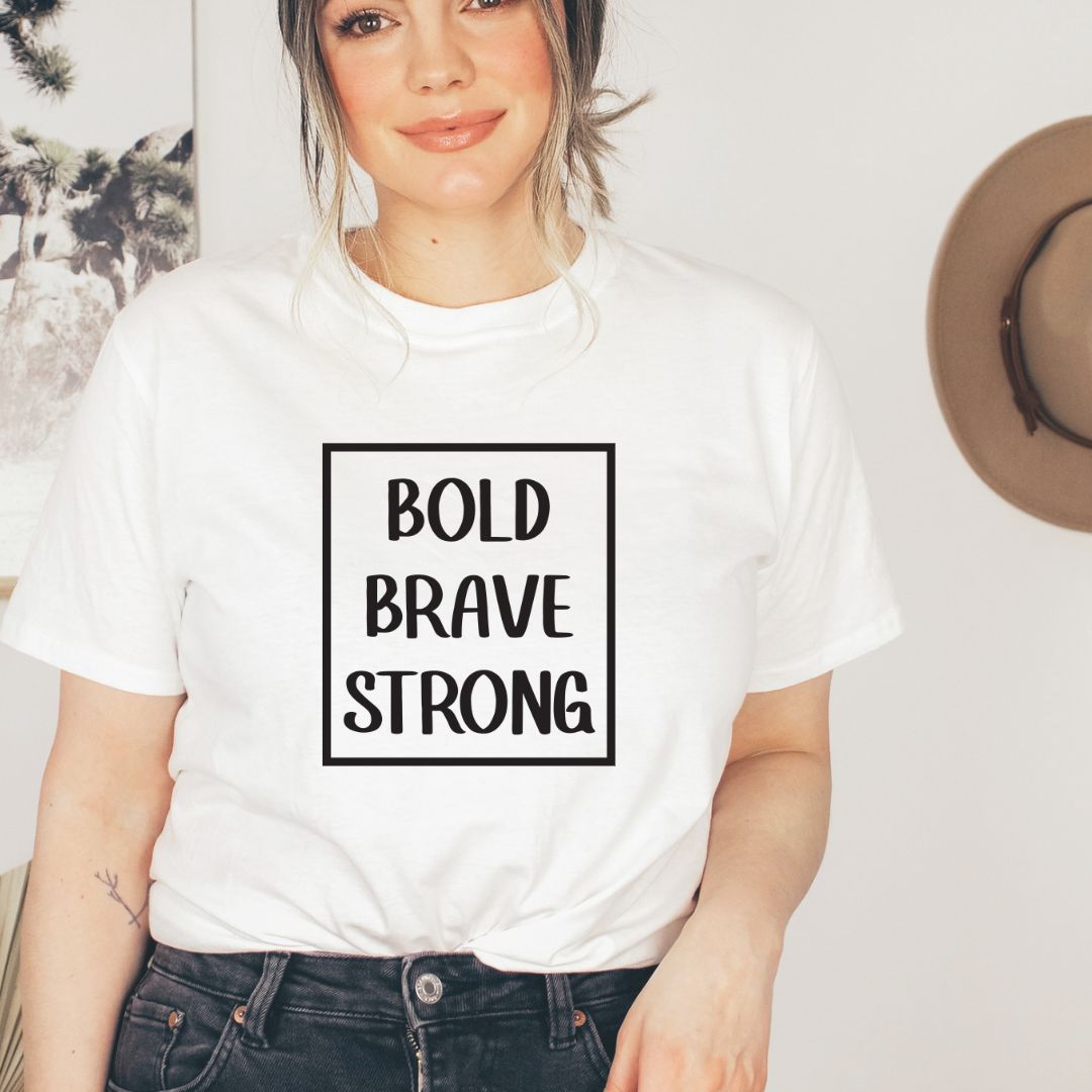 "Bold, brave, strong text design centered on white t-shirt."