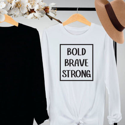 "Bold, brave, strong text design centered on white long sleeve shirt."