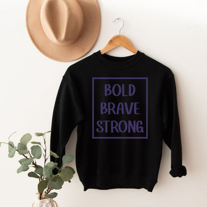 "Bold, brave, strong text design centered on black sweater."
