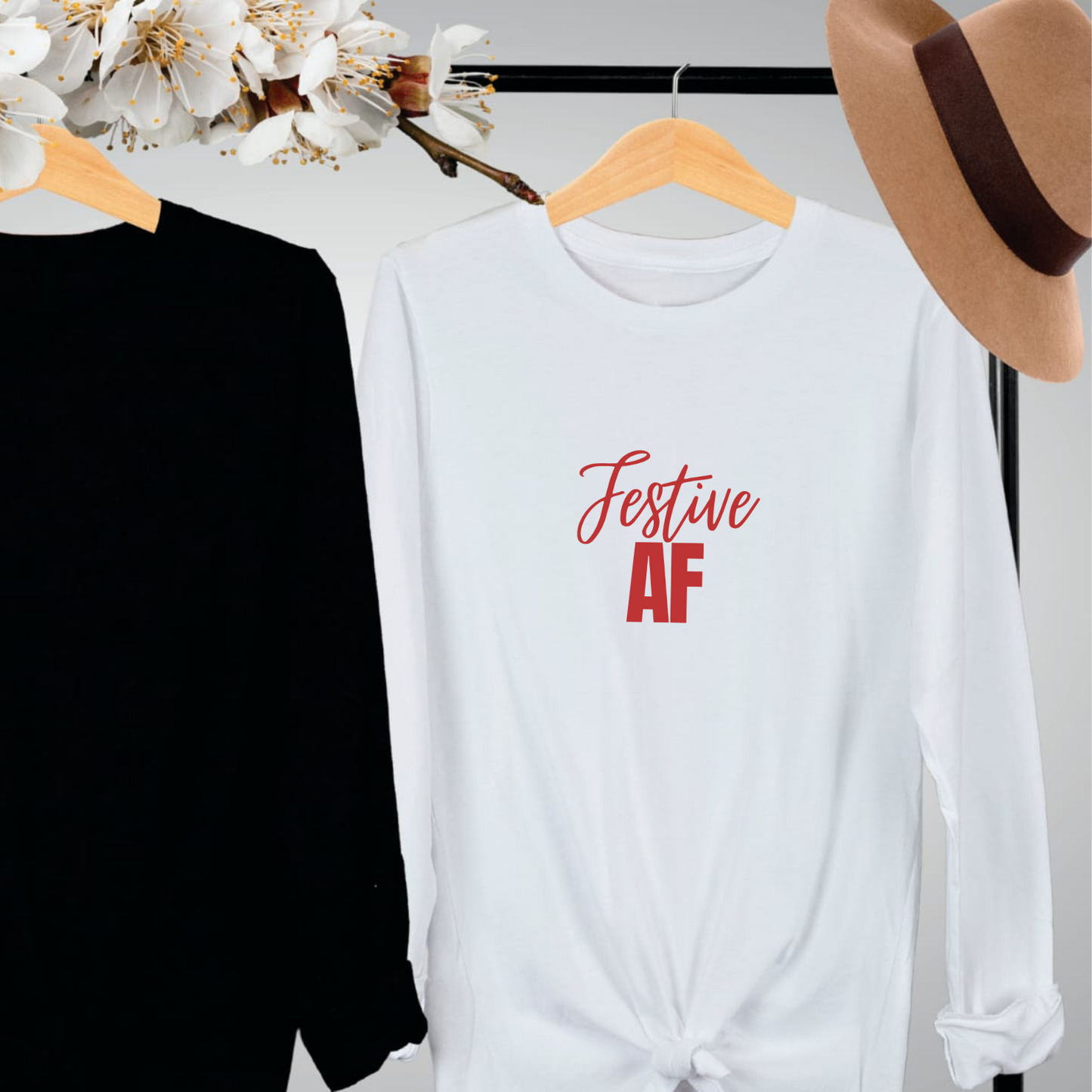 "Festive AF text design centered on a white unisex long sleeve shirt."