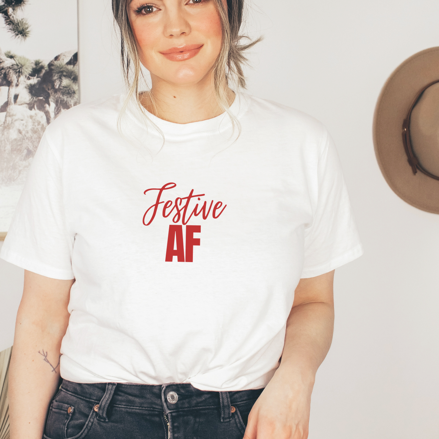 "Festive AF text design centered on a white unisex t-shirt."